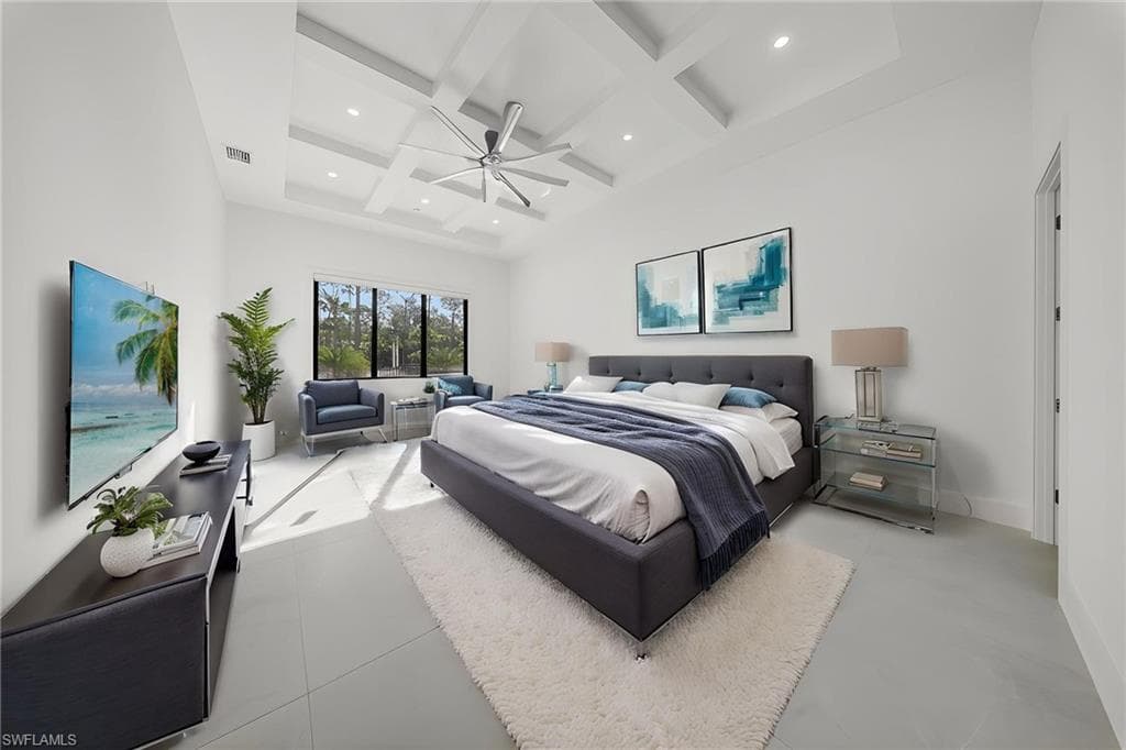 Bedroom with coffered ceiling, recessed lighting, and ceiling fan
