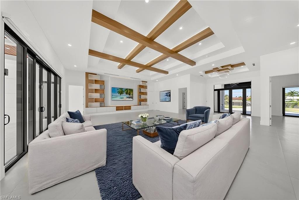 Living room featuring recessed lighting, french doors, and coffered ceiling