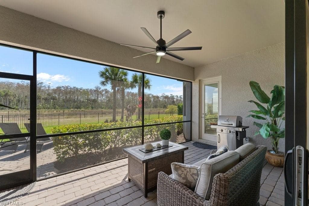 Sunroom with a ceiling fan