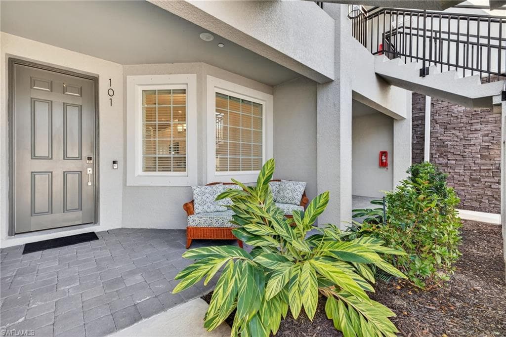 View of exterior entry featuring stucco siding