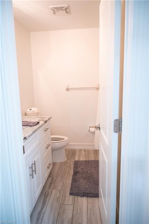 Bathroom with vanity and light wood-type flooring
