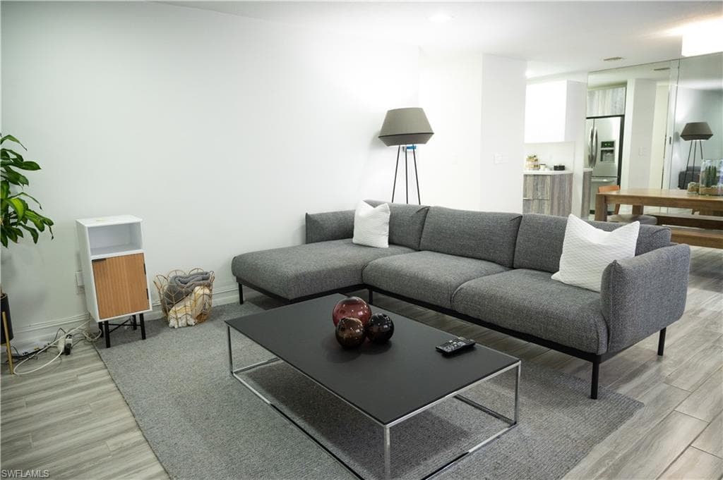 Living area with light wood-style flooring