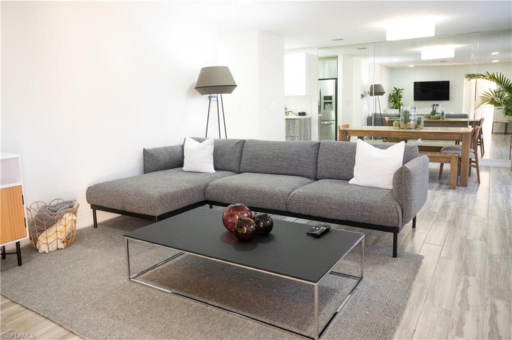 Living room featuring light wood-style flooring