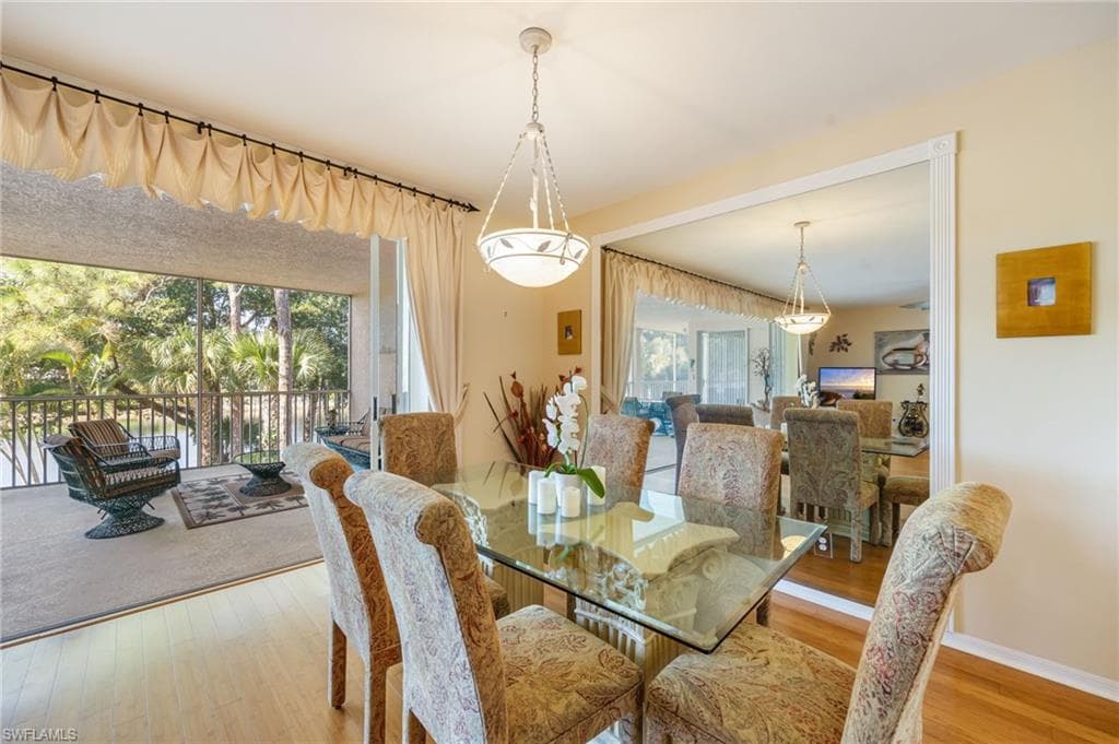 Dining area with light wood-style floors