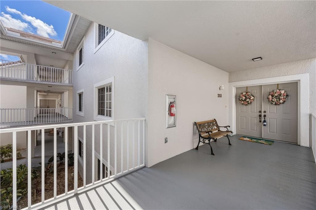 Property entrance with stucco siding