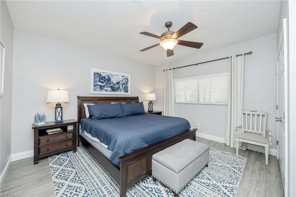 Bedroom featuring a ceiling fan and light wood finished floors