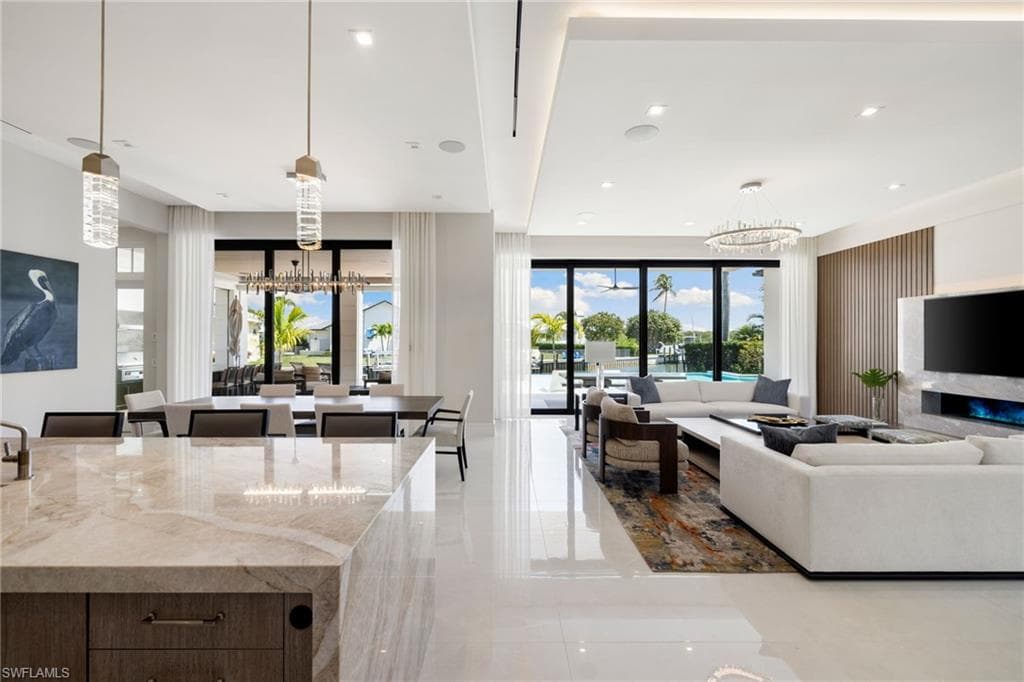 Living area featuring suspended lighting