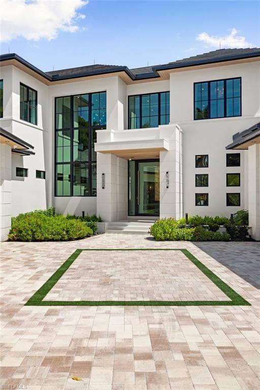 Entrance to property with stucco siding