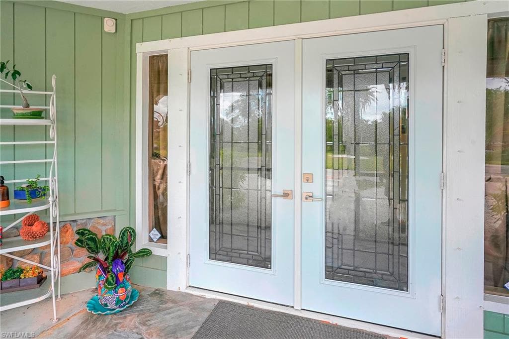 Property entrance with french doors
