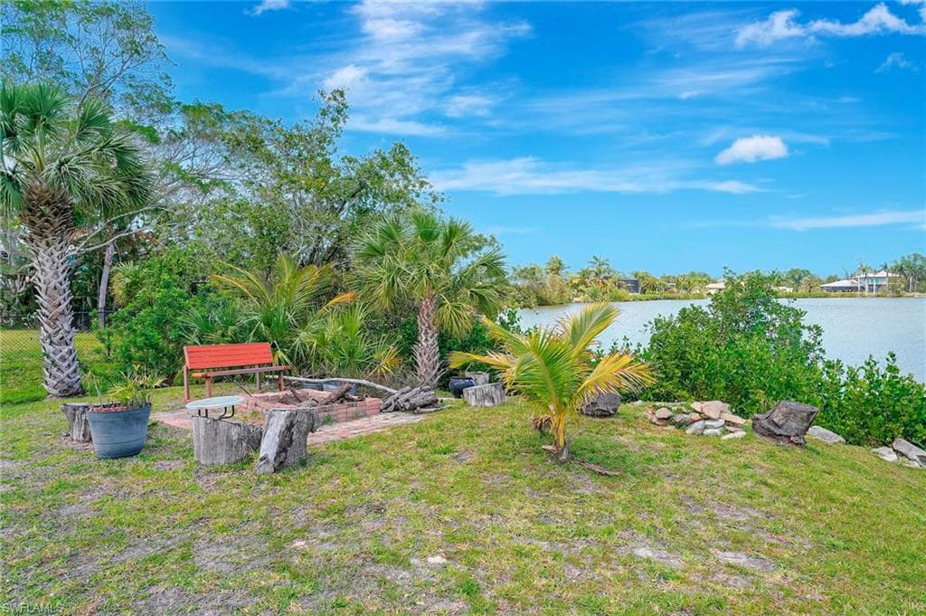 View of yard with a water view