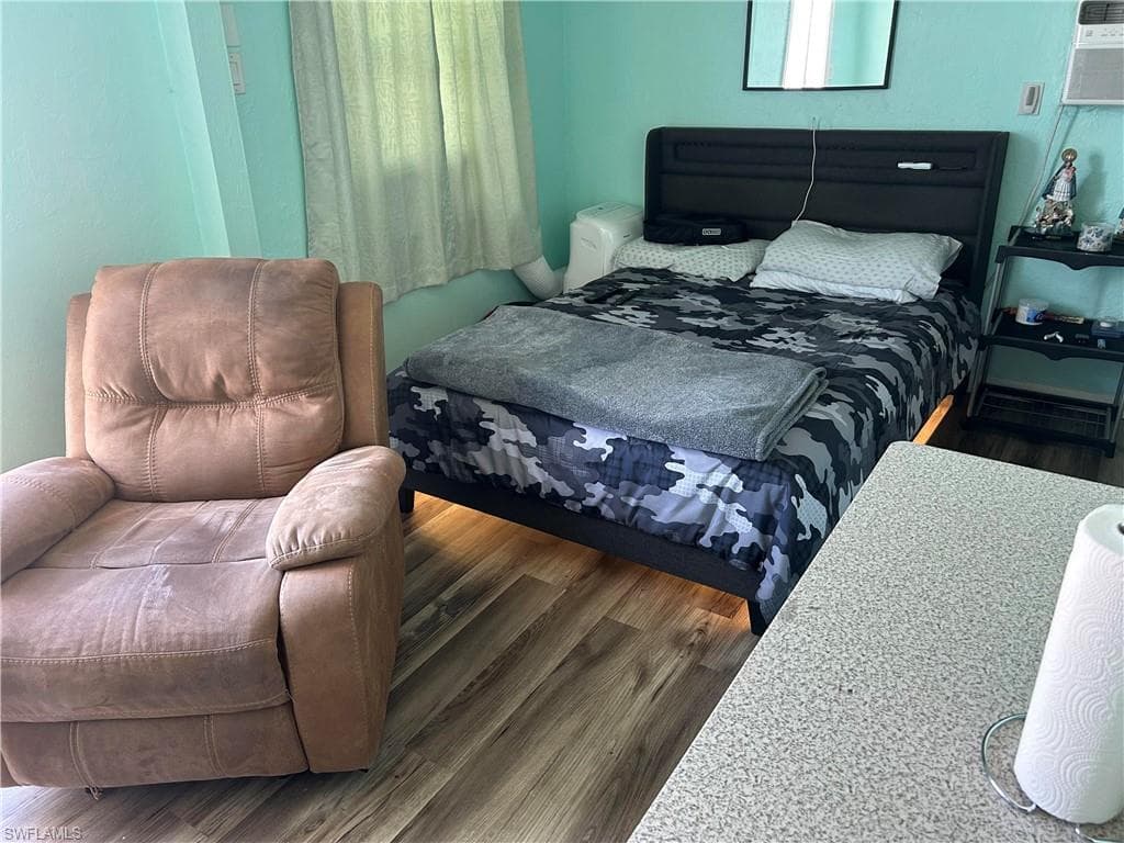 Bedroom featuring wood finished floors