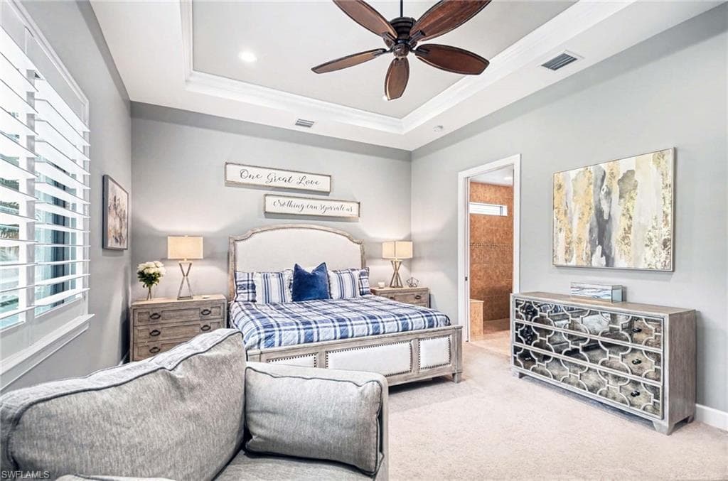 Carpeted bedroom featuring crown molding, ensuite bath, a ceiling fan, and recessed lighting