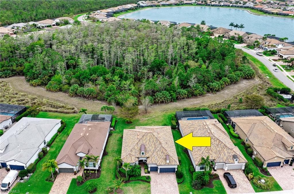 Aerial perspective of suburban area with a large body of water