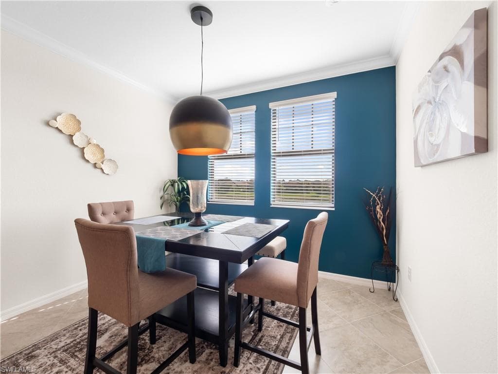Living area featuring ceiling fan, ornamental molding, and recessed lighting