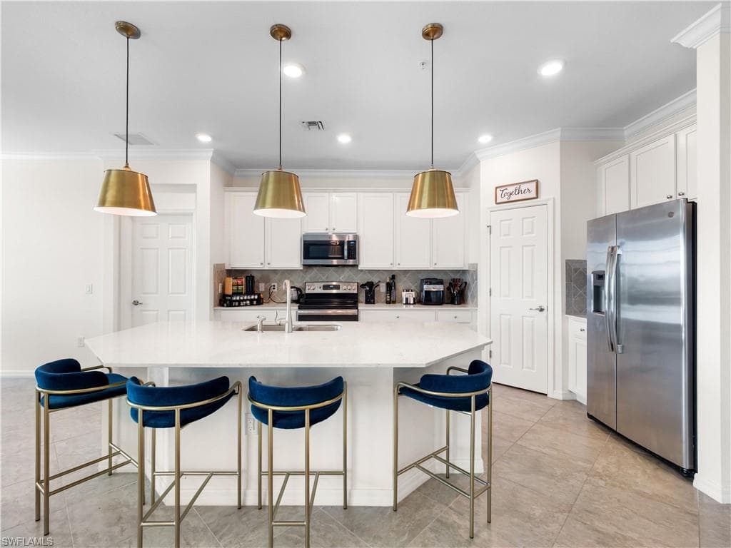 Living room with crown molding, ceiling fan, and recessed lighting