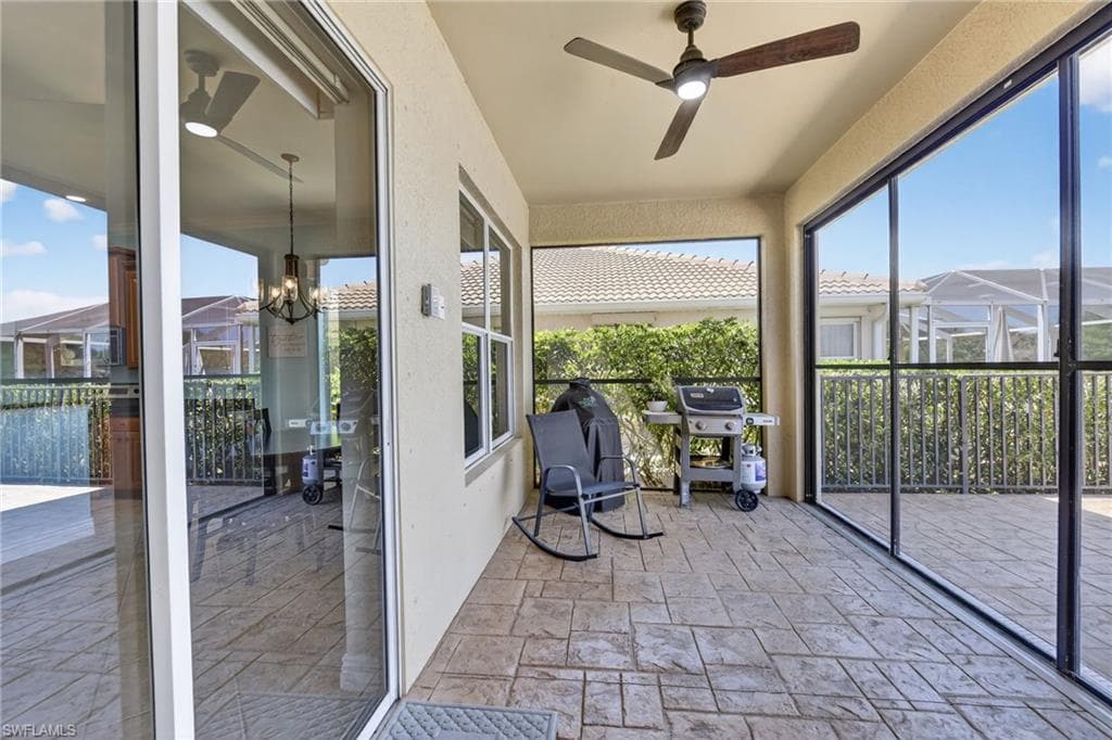 Covered screened in lanai and outdoor dining space.