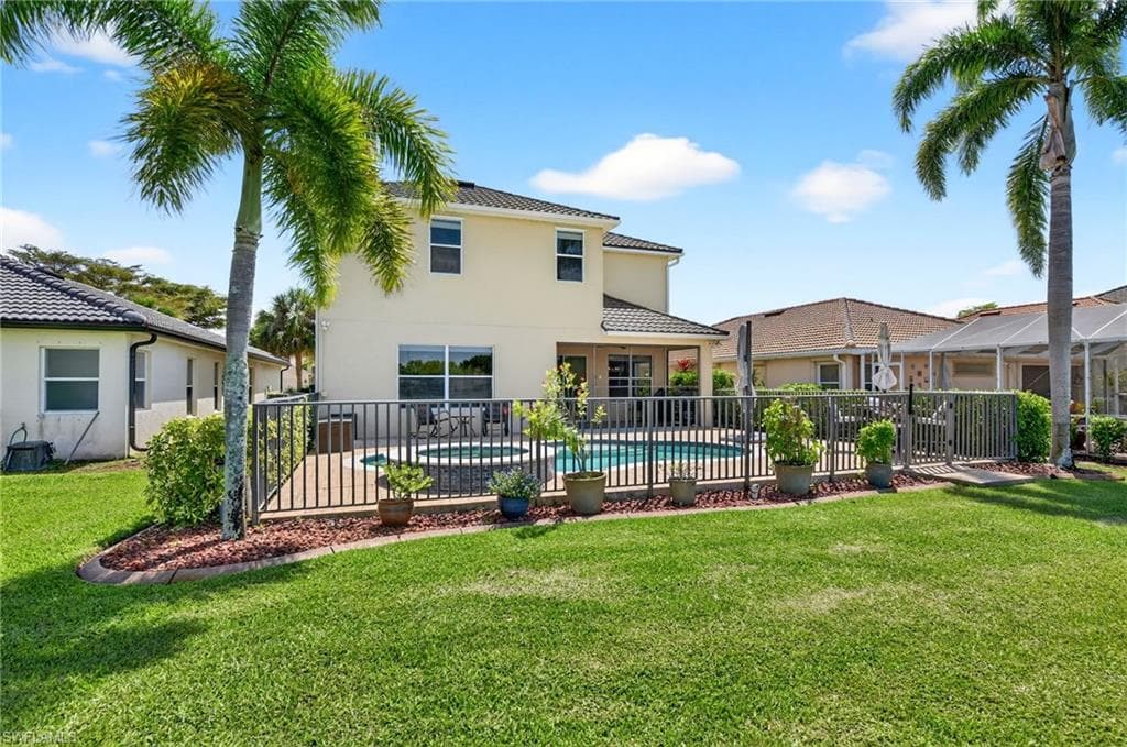 Rear view of property and a patio area