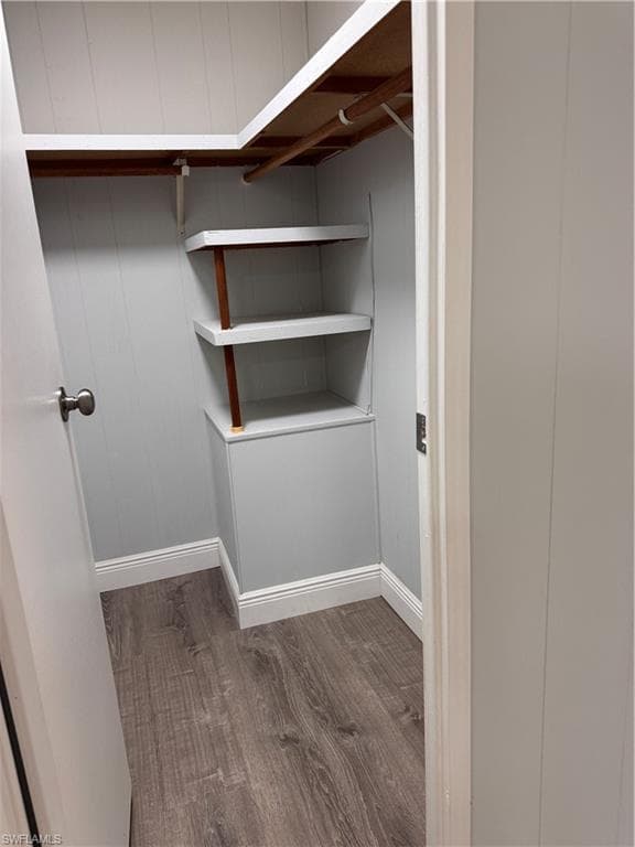 Master walk in closet with laminate flooring