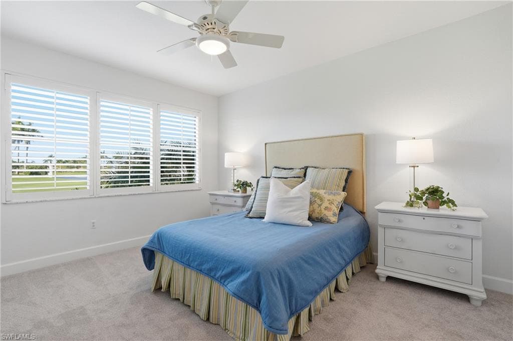 Bedroom with light carpet and ceiling fan