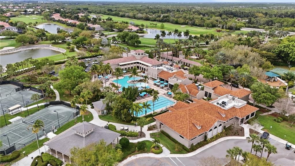 Drone / aerial view of a golf club and a large body of water