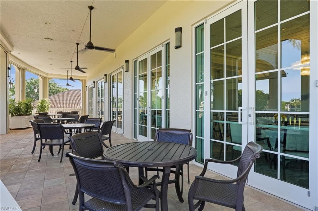 View of patio / terrace with french doors, outdoor dining area, and a ceiling fan