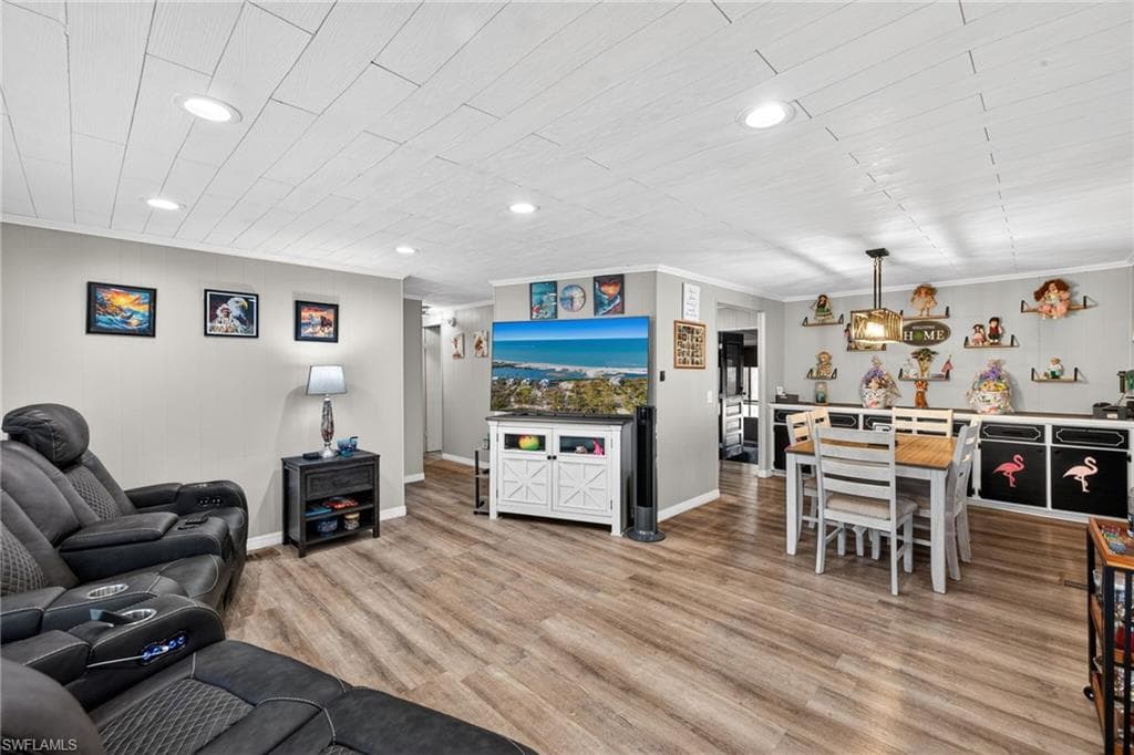 Living room featuring luxury vinyl wood plank flooring