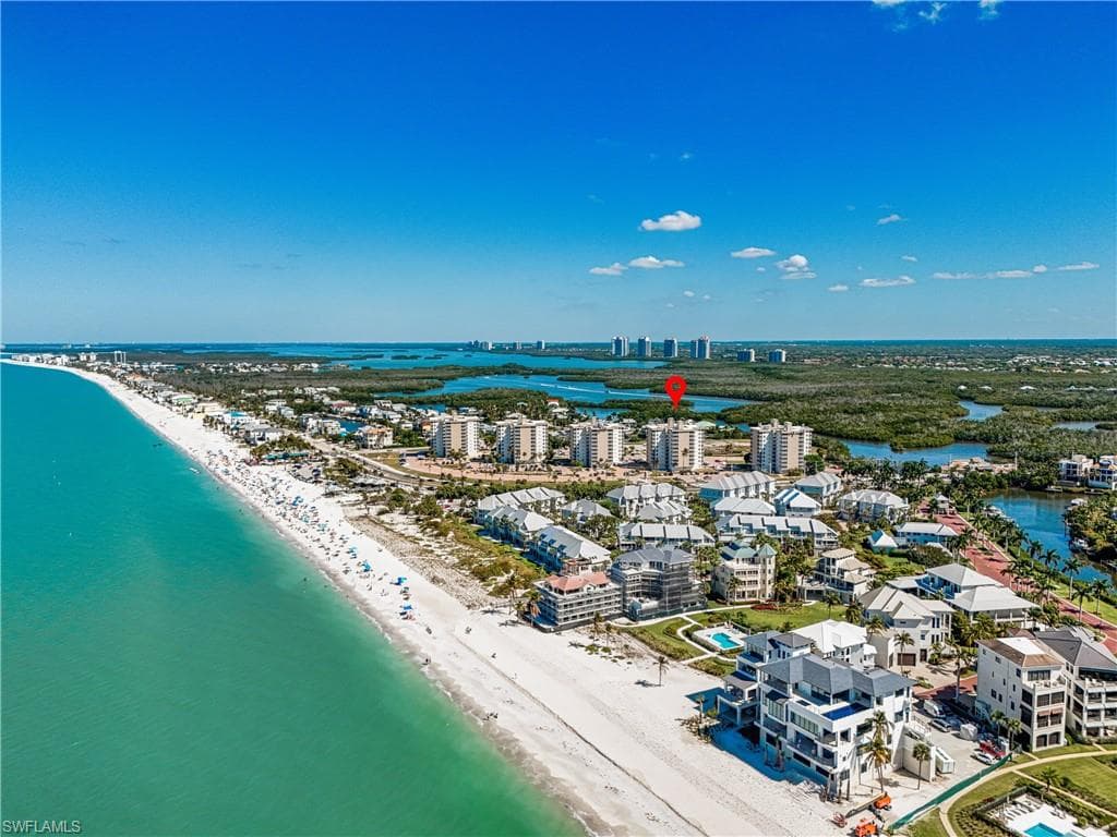 View of urban area featuring expansive beach