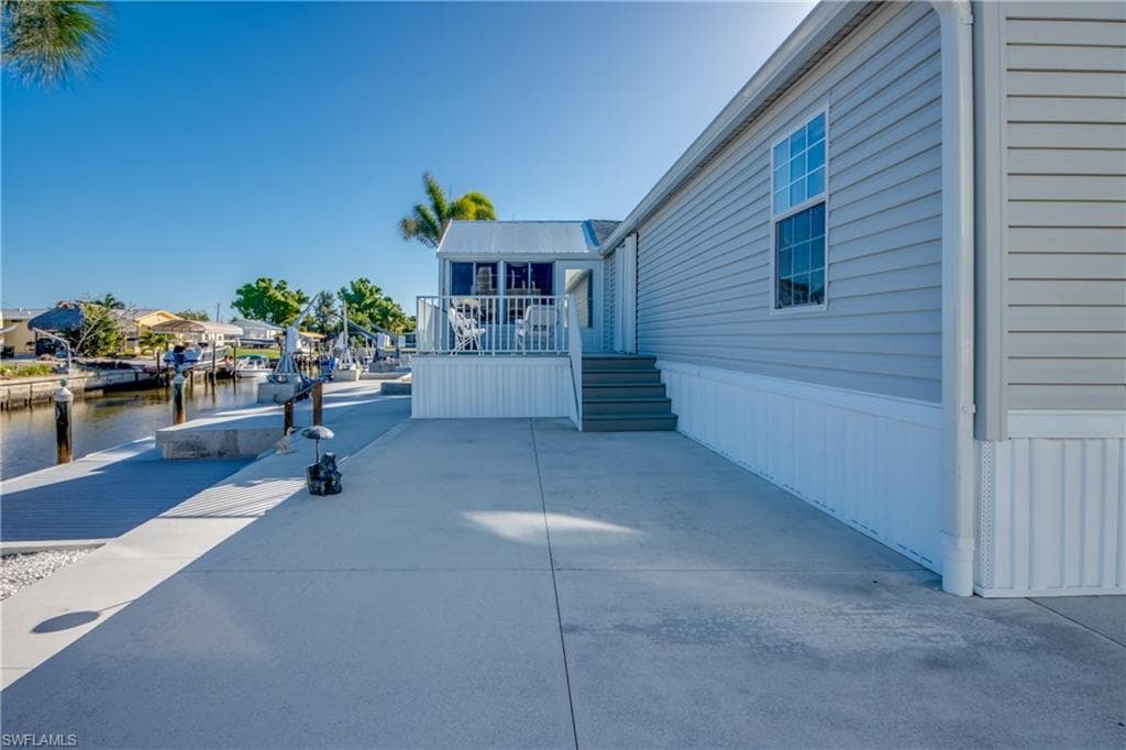View of patio / terrace with a water view
