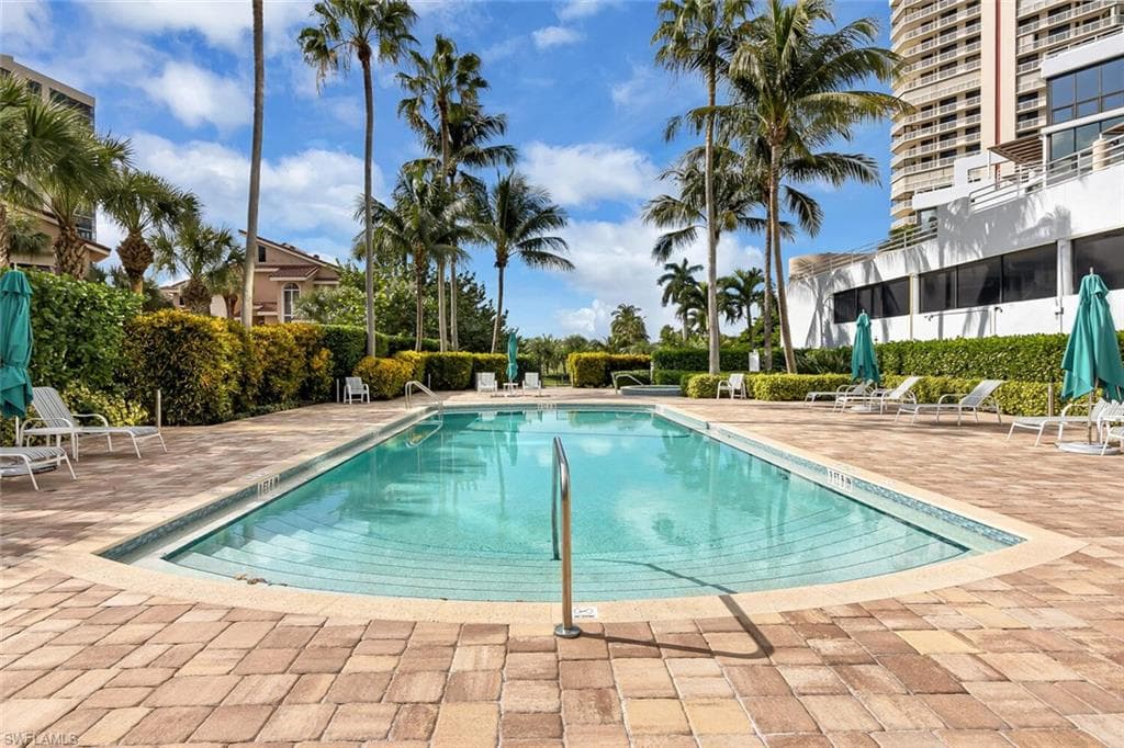 Community pool featuring a patio