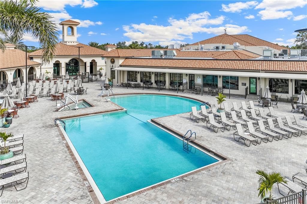 View of community pool with a patio area