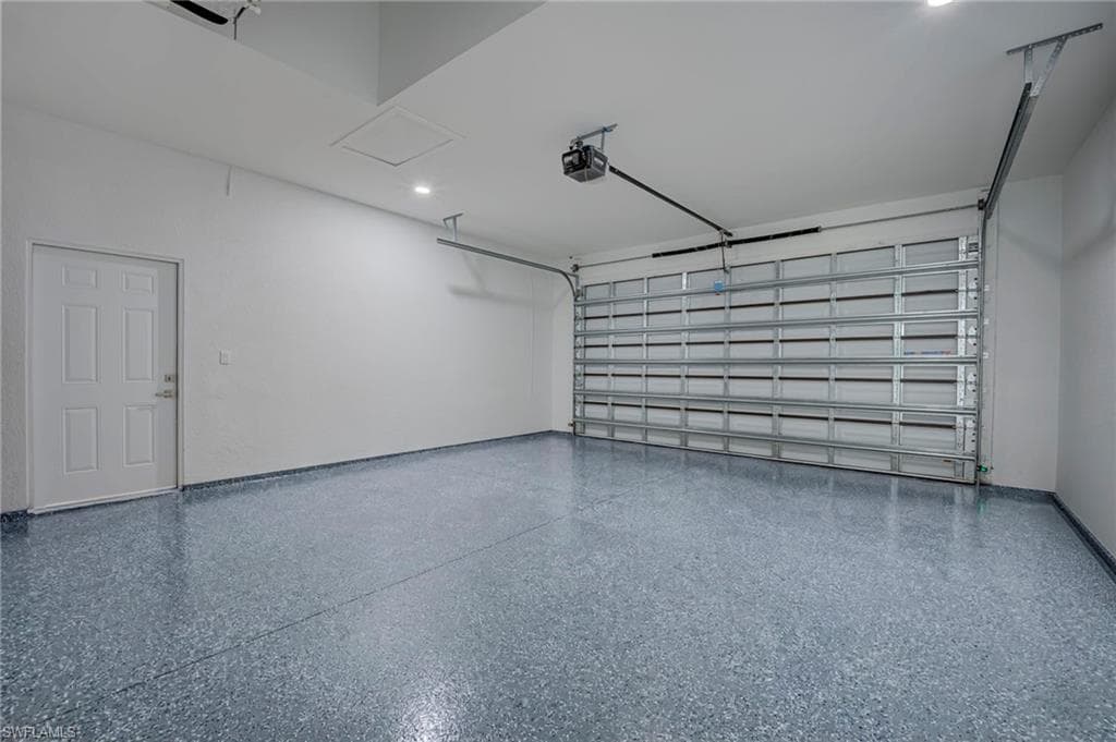 Garage featuring a garage door opener