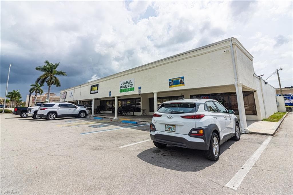 View of commercial location with uncovered parking
