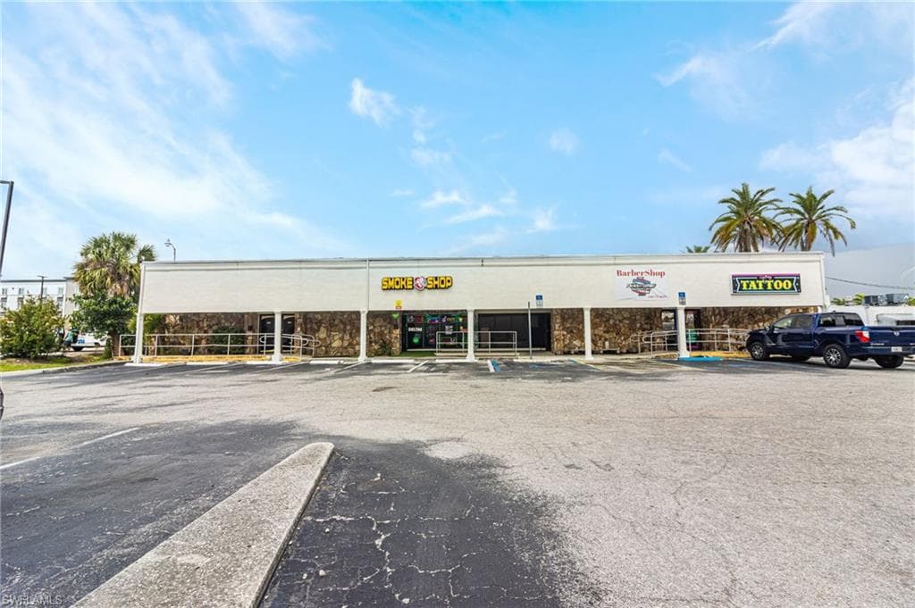 View of commercial location with uncovered parking