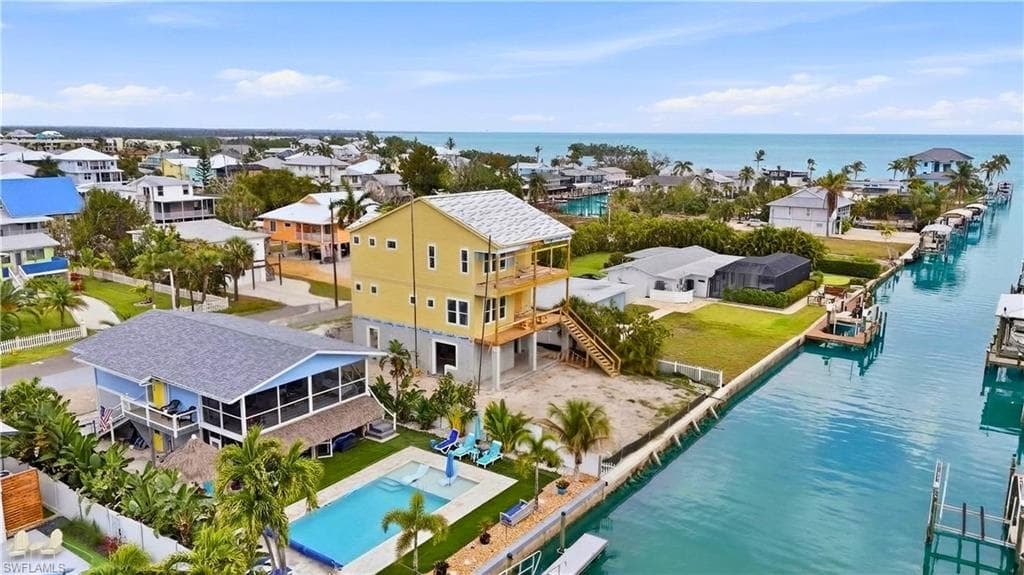 Aerial view of residential area with a nearby body of water - Virtually Edited Image