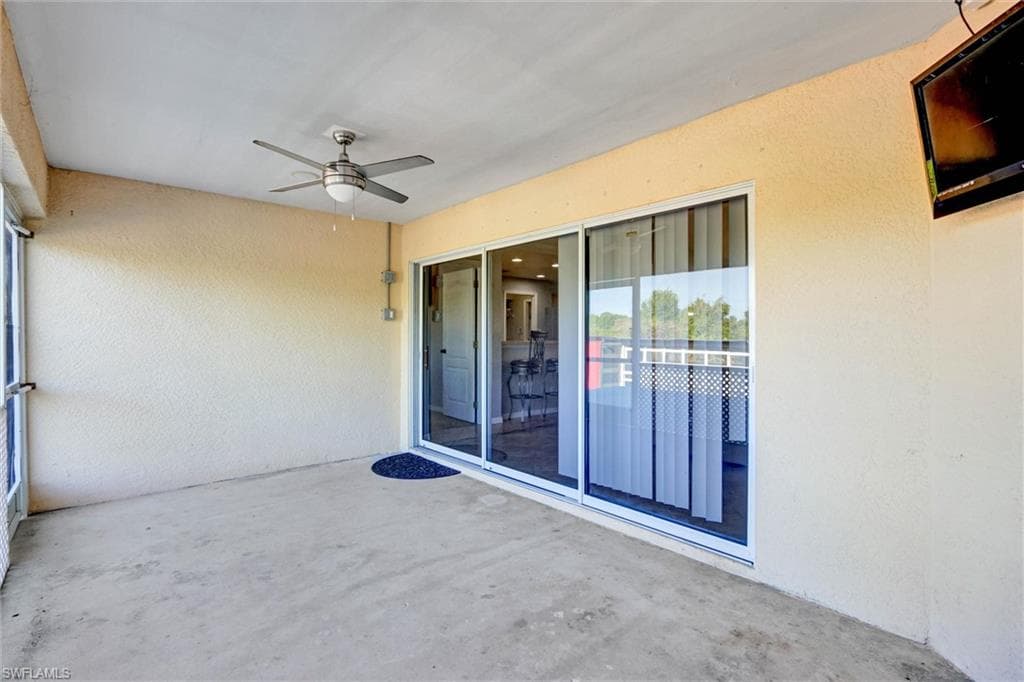 View of patio / terrace featuring ceiling fan and a sunroom