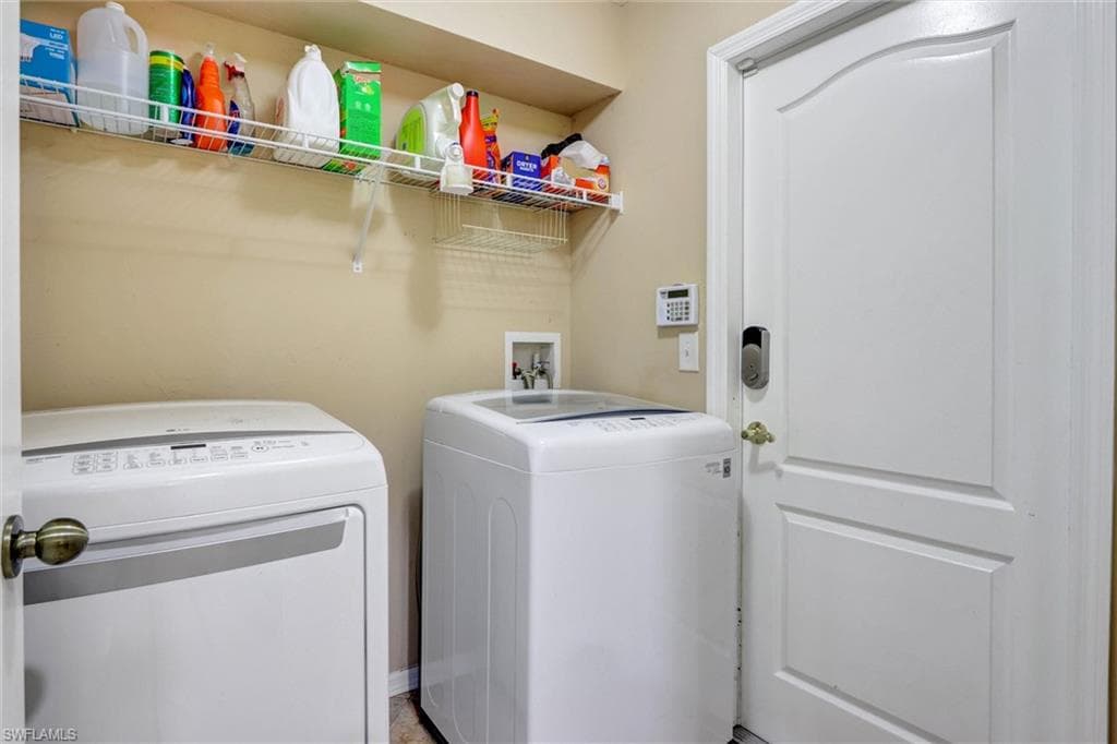 Laundry room featuring independent washer and dryer