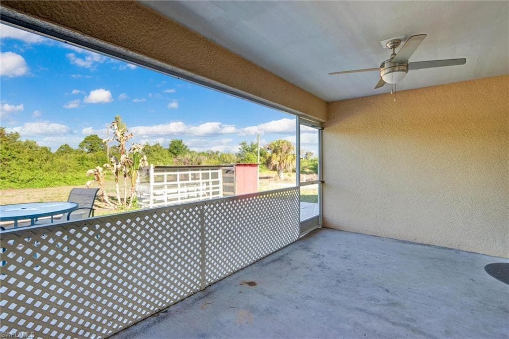 Balcony featuring ceiling fan