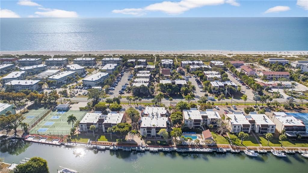 Aerial perspective of suburban area with a nearby body of water