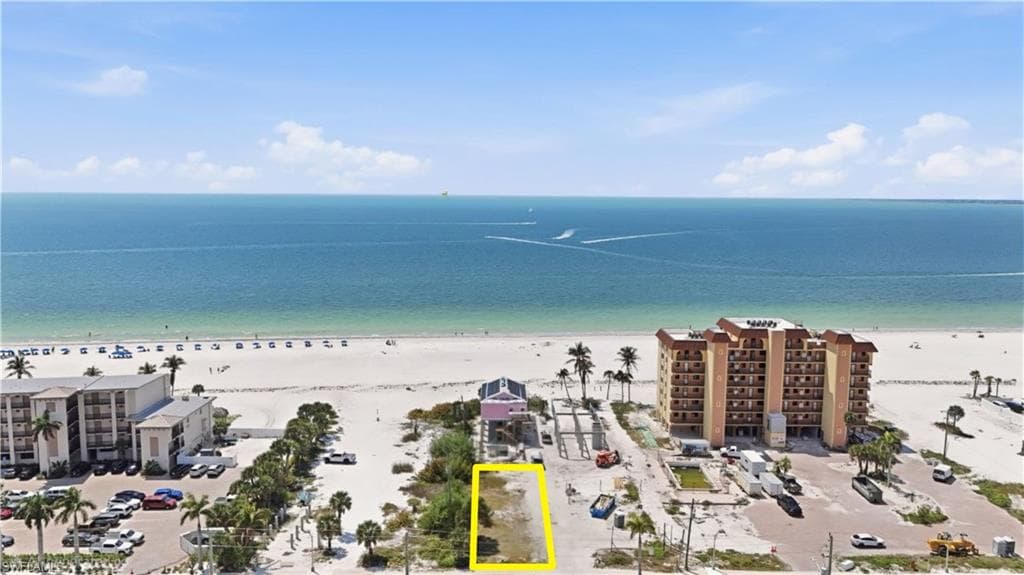 View of property location with waterfront with a beach and property parcel outlinedchange color of water into natural dark blue canal water