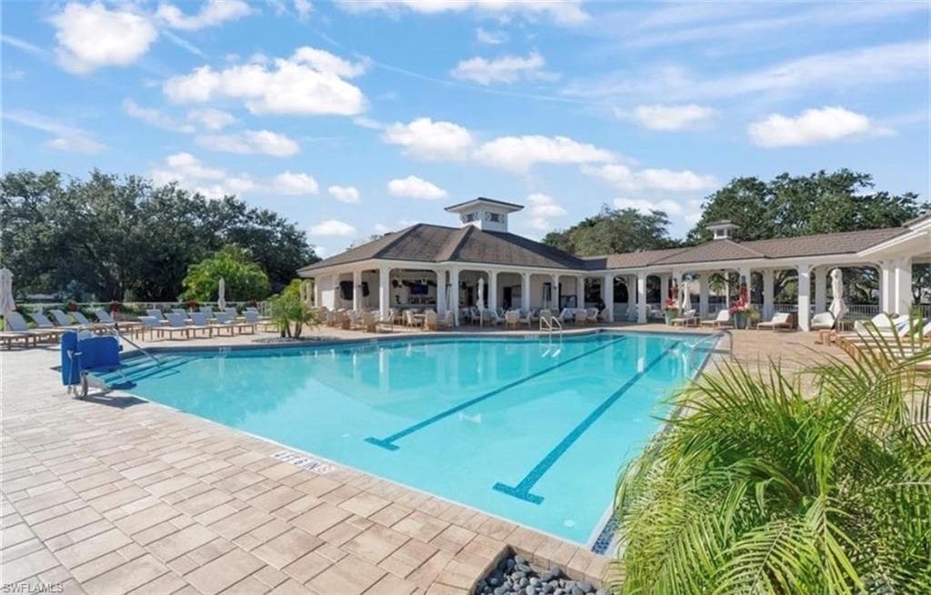 Community pool with a patio area