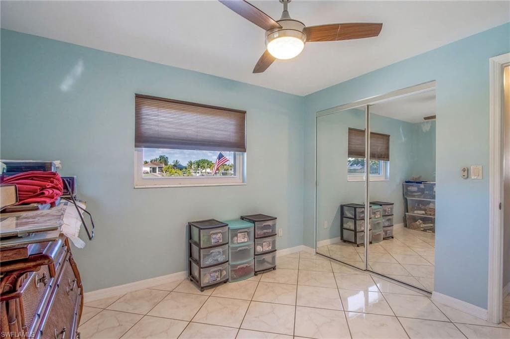 Office space featuring baseboards and ceiling fan