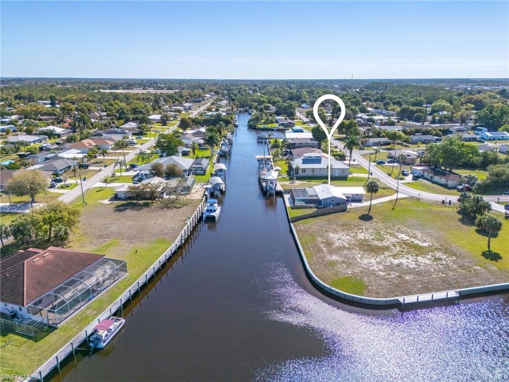 Aerial view of residential area with a large body of water