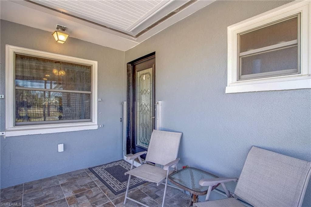 Property entrance with stucco siding