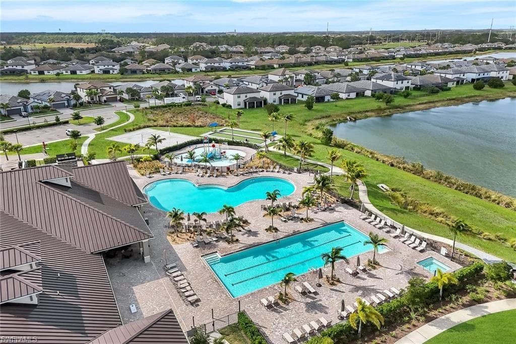 Aerial perspective of clubhouse area with two pool areas