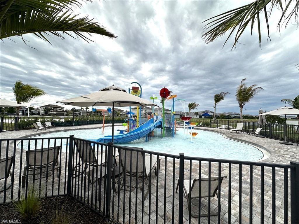 View of splash pad with a patio