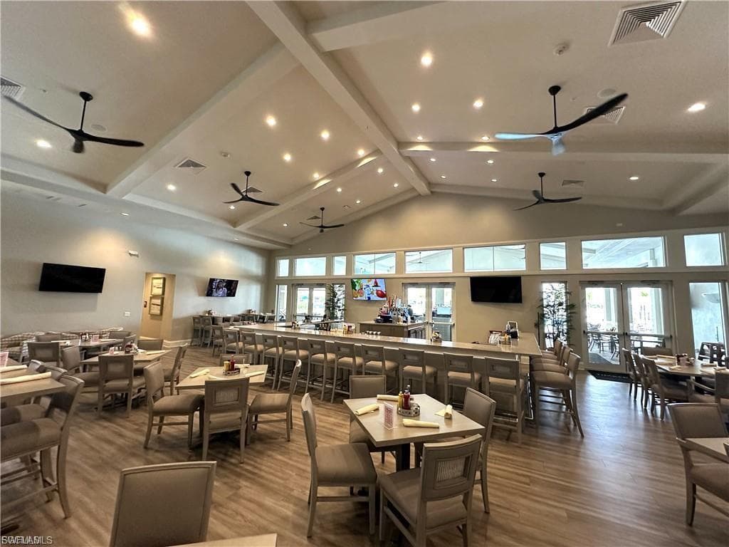 In door dining area at the club house, featuring recessed lighting, and plenty of natural light, Bar with seating