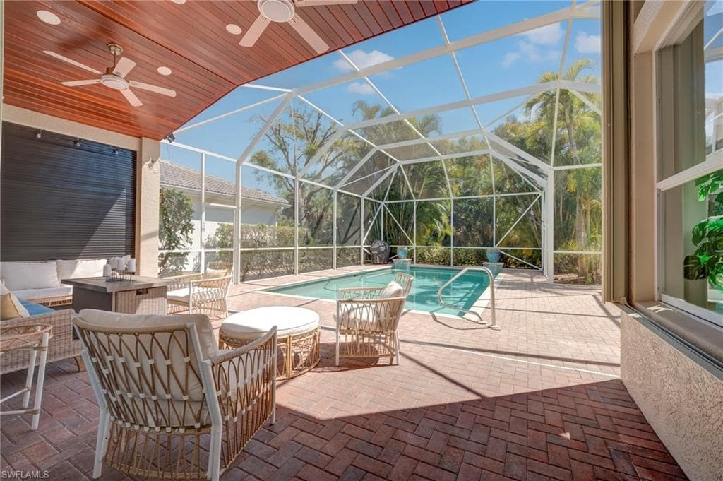 Outdoor pool with a patio area, a screen enclosure