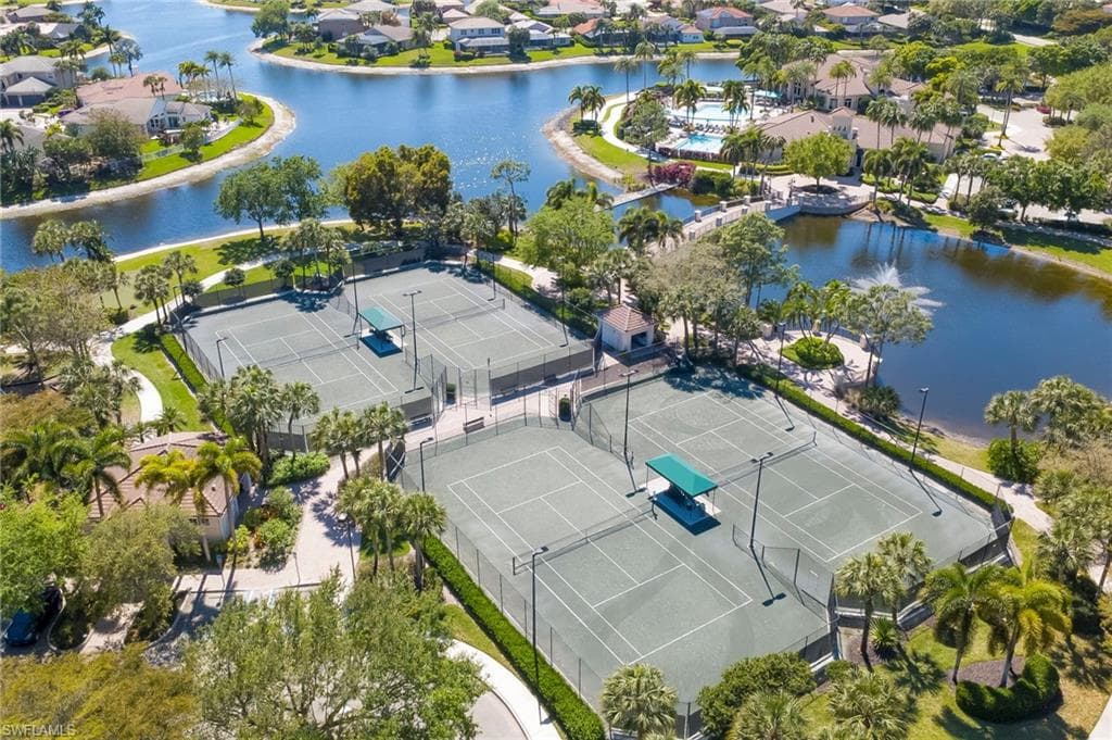 Aerial perspective of suburban area with a nearby body of water