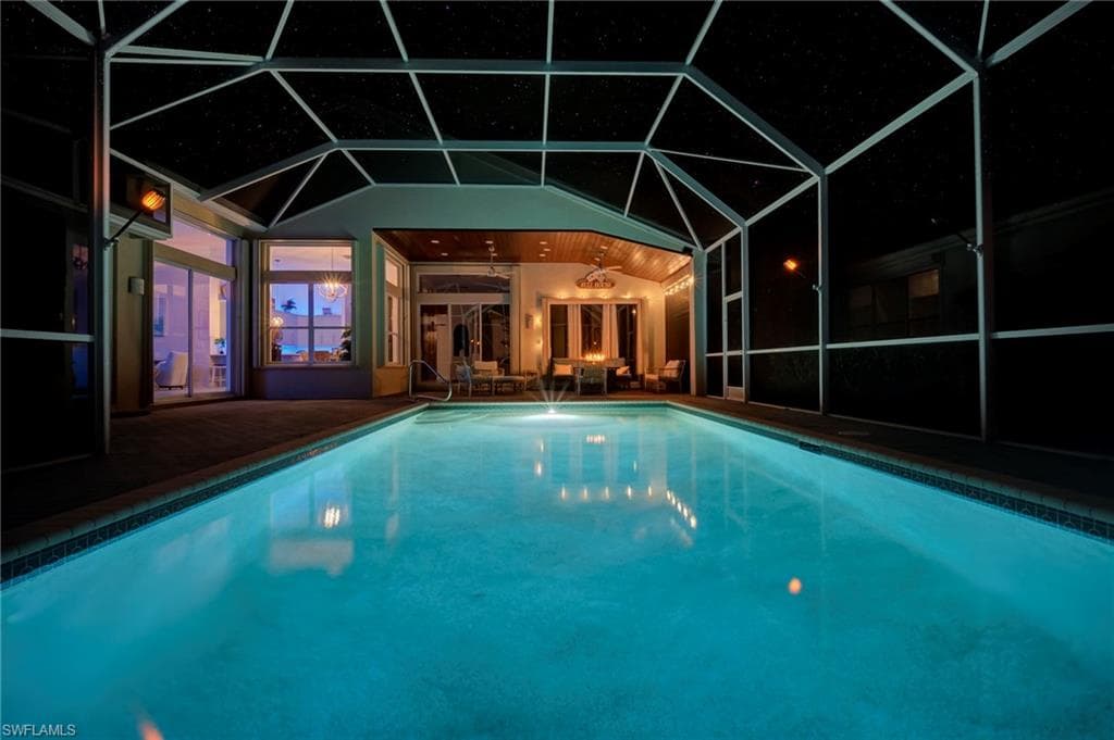 Pool at night with an outdoor pool