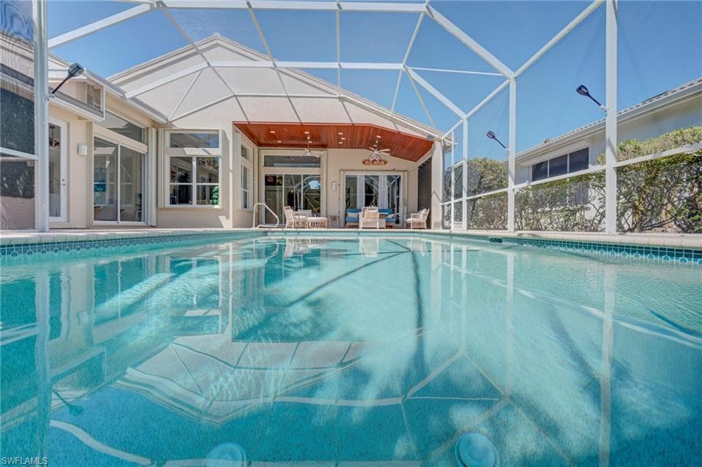 Swimming pool featuring a lanai, and a patio area